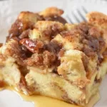 A delicious French Toast Casserole baked with buttery bread and topped with syrup
