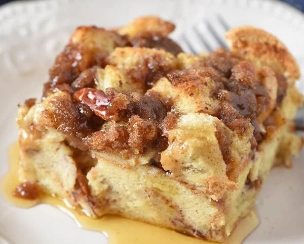 A delicious French Toast Casserole baked with buttery bread and topped with syrup