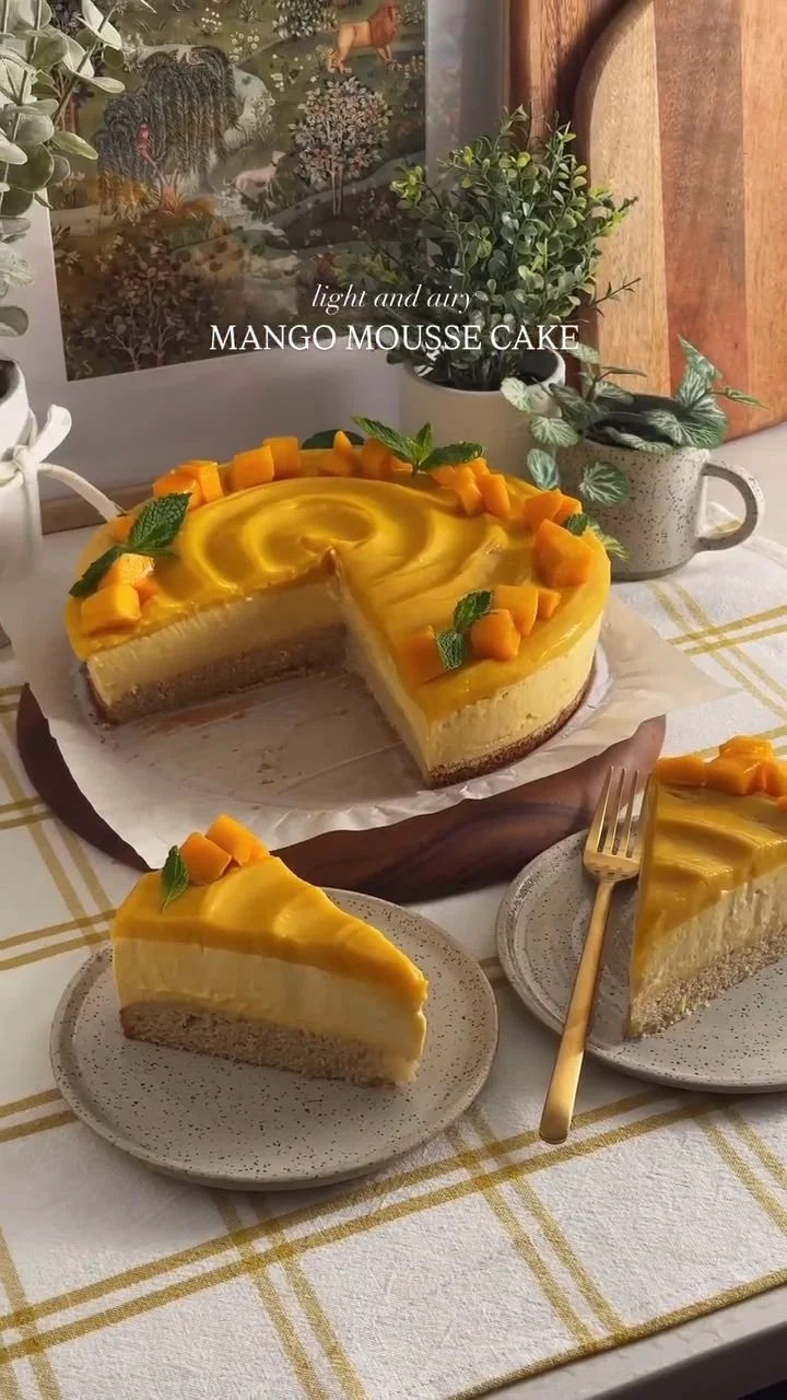 Delicious Mango Mousse Cake topped with fresh mango slices