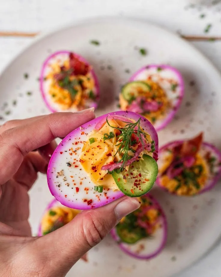 Perfectly pink deviled eggs with vibrant color and creamy filling.
