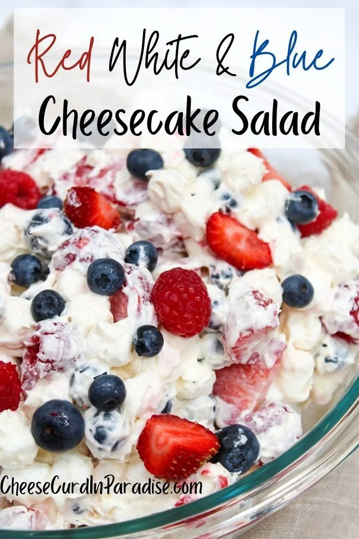 Red White and Blue Cheesecake Salad served in a bowl with fresh berries