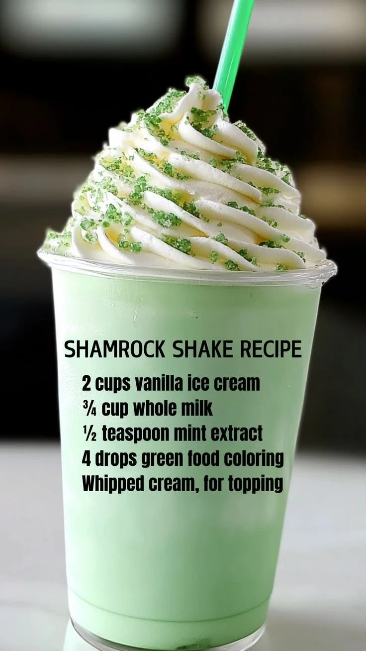 A refreshing Shamrock Shake topped with whipped cream and a cherry.